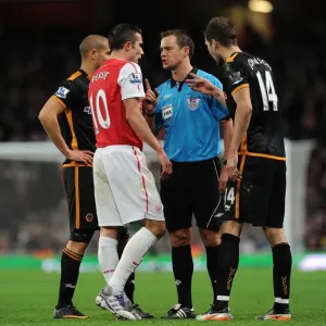 Arsenal's Van Persie Clashes with Wolves Johnson during Premier League Encounter (2011-2012)