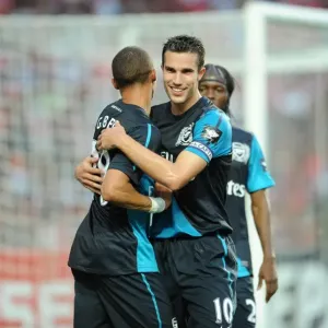 Arsenal's Van Persie and Gibbs: Celebrating a Goal Against Benfica (2011-12) Arsenal's Van Persie and Gibbs: Celebrating a Goal Against Benfica (2011-12)
