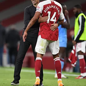 Arsenal's Victory: Arteta Embraces Aubameyang after Arsenal v West Ham United (2020-21)