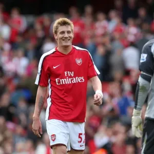 Arsenal's Victory: Bendtner Celebrates with Robinson after a 6-2 Thrashing of Blackburn Arsenal's Victory: Bendtner Celebrates with Robinson after a 6-2 Thrashing of Blackburn