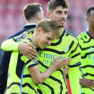 Arsenal's Victory: Martin Odegaard and Kai Havertz Celebrate at Vitality Stadium (AFC Bournemouth vs Arsenal, 2023-24)