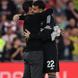 Arsenal's Victory: Mikel Arteta Celebrates with David Raya after Beating Manchester City (2023-24) Arsenal's Victory: Mikel Arteta Celebrates with David Raya after Beating Manchester City (2023-24)