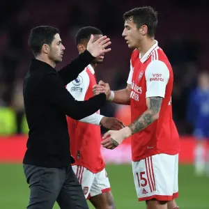 Arsenal's Victory: Mikel Arteta Embraces Jakob Kiwior After Arsenal v Chelsea Match, Premier League 2022-23 Arsenal's Victory: Mikel Arteta Embraces Jakob Kiwior After Arsenal v Chelsea Match, Premier League 2022-23