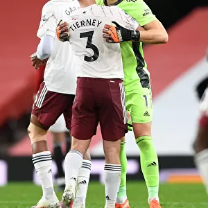 Arsenal's Victory at Old Trafford: Bernd Leno and Kieran Tierney Celebrate in Empty Old Trafford (Manchester United vs Arsenal, 2020-21)