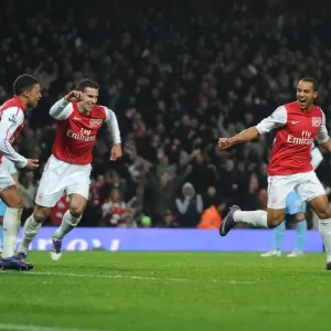 Arsenal's Walcott, van Persie, and Oxlade-Chamberlain Celebrate Goals against Aston Villa in FA Cup