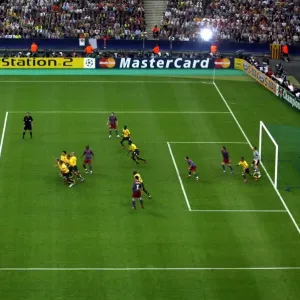 Arsenals wall rushes to charge down Ronaldinho (Barca) shot Arsenals wall rushes to charge down Ronaldinho (Barca) shot