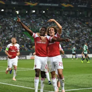 Arsenal's Welbeck and Guendouzi Celebrate Goal Against Sporting Lisbon in Europa League Arsenal's Welbeck and Guendouzi Celebrate Goal Against Sporting Lisbon in Europa League