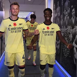 Arsenal's White and Saka Celebrate Victory Over Leicester City in 2021-22 Premier League