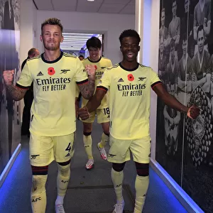 Arsenal's White and Saka Celebrate Win Against Leicester City (2021-22)