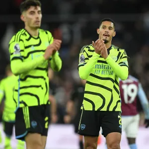 Arsenal's William Saliba Celebrates with Fans after Aston Villa Victory (2023-24) Arsenal's William Saliba Celebrates with Fans after Aston Villa Victory (2023-24)
