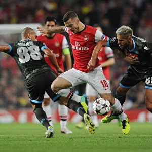 Arsenal's Wilshere Faces Off Against Inler and Behrami of Napoli in Champions League Clash