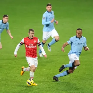 Arsenal's Wilshere Faces Off Against Manchester City's Midfield Trio: Milner, Garcia, and Kompany Arsenal's Wilshere Faces Off Against Manchester City's Midfield Trio: Milner, Garcia, and Kompany