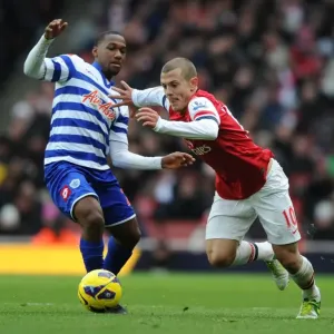 Arsenal's Wilshere Outsmarts Hoilett: Midfield Maestro Dazzles in Arsenal vs. QPR (2012-13 Premier League)