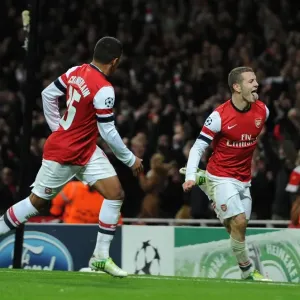 Arsenal's Wilshere and Oxlade-Chamberlain Celebrate First Goal in Champions League Match Against Montpellier (2012-13)
