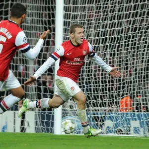 Arsenal's Wilshere and Oxlade-Chamberlain Celebrate Goal Against Montpellier (2012-13)