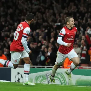Arsenal's Wilshere and Oxlade-Chamberlain: Celebrating a Goal Against Montpellier (2012-13)