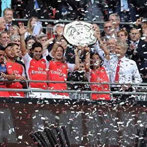 Arsenal's Winning Squad: Arteta, Rosicky, Cazorla, and Wenger Celebrate FA Community Shield Triumph