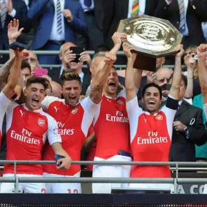 Arsenal's Winning Squad: Bellerin, Mertesacker, Arteta, Monreal, and Giroud Lift the FA Community Shield Arsenal's Winning Squad: Bellerin, Mertesacker, Arteta, Monreal, and Giroud Lift the FA Community Shield