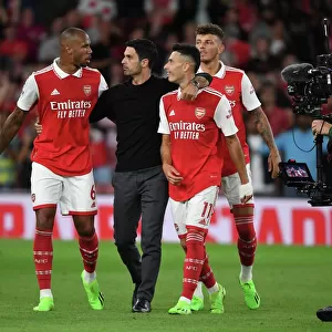 Arsenal's Winning Team: Arteta Celebrates with Gabriel, Martinelli, and White
