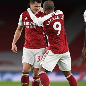 Arsenal's Xhaka and Lacazette Celebrate Goals in Empty Emirates Stadium During Arsenal v Chelsea Match, 2020-21 Premier League
