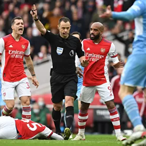 Arsenal's Xhaka and Lacazette Confer with Referee during Arsenal vs Manchester City (2021-22)