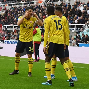 Arsenal's Xhaka, Maitland-Niles, and Aubameyang in Action against Newcastle United (2019-20)