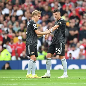 Arsenal's Xhaka Passes Captaincy to Odegaard in Manchester United Clash (2022-23)
