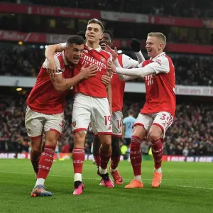 Arsenal's Xhaka, Zinchenko, and Trossard Celebrate Goal Against Brentford (2022-23) Arsenal's Xhaka, Zinchenko, and Trossard Celebrate Goal Against Brentford (2022-23)