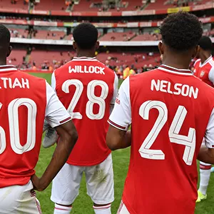 Arsenal's Young Stars: Nketiah, Willock, and Nelson Celebrate Emirates Cup Victory over Olympique Lyonnais