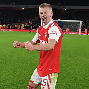 Arsenal's Zinchenko Leads Victory Celebrations Over Manchester United in Premier League Showdown