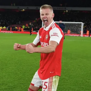 Arsenal's Zinchenko Leads Victory Celebrations Over Manchester United in Premier League Showdown
