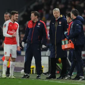 Arsene Wenger and Aaron Ramsey Consult Arsenal's Physio during Hull City FA Cup Match Arsene Wenger and Aaron Ramsey Consult Arsenal's Physio during Hull City FA Cup Match