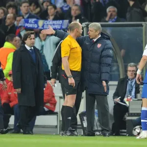 Arsene Wenger Argues with Referee Martin Hansson After Porto's Second Goal in UEFA Champions League Clash