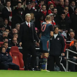 Arsene Wenger and Arjen Robben: A Tense Moment Between Arsenal and Bayern Munich in the UEFA Champions League Arsene Wenger and Arjen Robben: A Tense Moment Between Arsenal and Bayern Munich in the UEFA Champions League