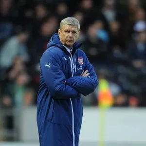 Arsene Wenger and Arsenal Face Off Against Hull City in 2014/15 Premier League Clash