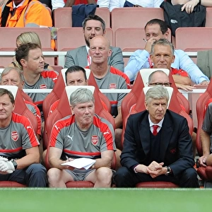 Arsene Wenger the Arsenal Manager on the bench with Gary Lewin (Physio), Pat Rice