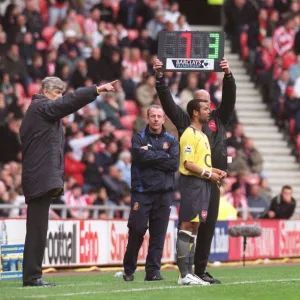 Arsene Wenger the Arsenal Manager brings on substitute Ashley Cole (Arsenal)