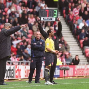 Arsene Wenger the Arsenal Manager brings on substitute Ashley Cole (Arsenal)