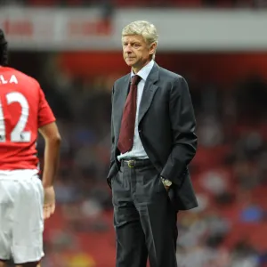 Arsene Wenger the Arsenal Manager with Carlos Vela