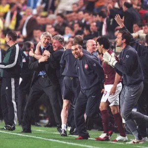 Arsene Wenger the Arsenal Manager celebrates with his Assistant Pat Rice at the final whistle