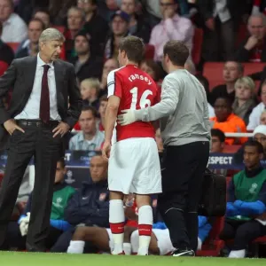 Arsene Wenger the Arsenal Manager chats to Aaron Ramsey Arsene Wenger the Arsenal Manager chats to Aaron Ramsey