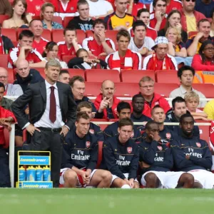 Arsene Wenger the Arsenal Manager with Lucazade bottles