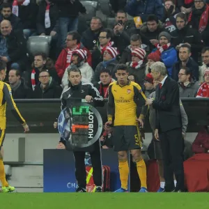 Arsene Wenger the Arsenal Manager oversees the substitution of Laurent Koscielny