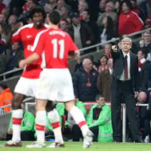 Arsene Wenger the Arsenal Manager passes on some instructions