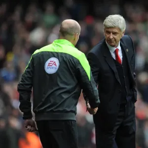 Arsene Wenger the Arsenal Manager shakes hands with Lee Mason the Fourth Official before the match Arsene Wenger the Arsenal Manager shakes hands with Lee Mason the Fourth Official before the match