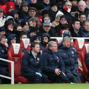 Arsene Wenger the Arsenal Manager sits with Colin Lewin (Physio) and Pat Rice