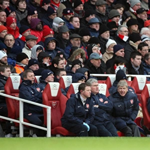 Arsene Wenger the Arsenal Manager sits in the dug out. Arsenal 2: 2 Everton
