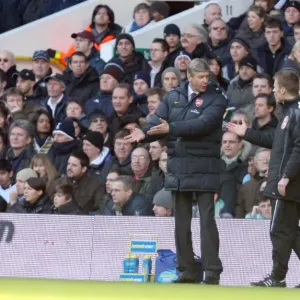 Arsene Wenger the Arsenal Manager talks with the 4th official