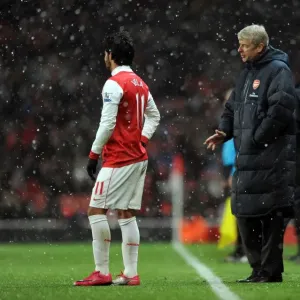 Arsene Wenger the Arsenal Manager talks to Carlos Vela (Arsenal). Arsenal 2