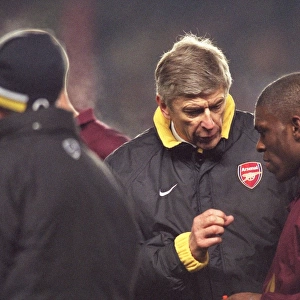 Arsene Wenger the Arsenal manager talks to Kerrea Gilbert (Arsenal) before the start of extra time